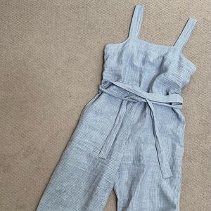 Everlane linen romper with waist tie.